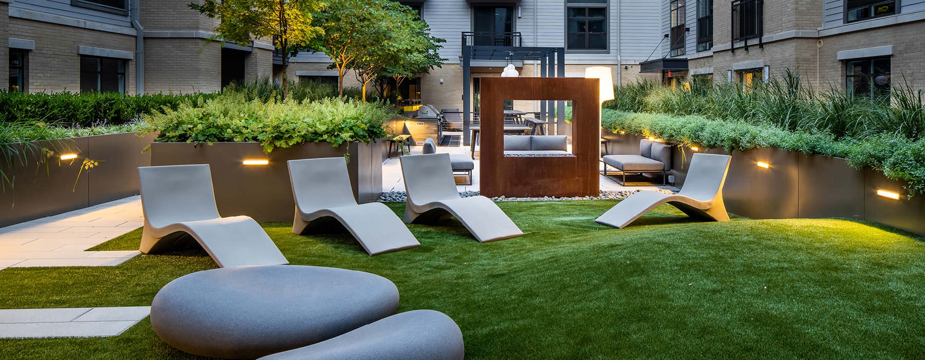 lawn with lounge chairs in courtyard